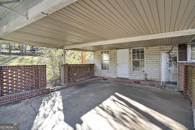 view of patio featuring a carport and covered porch