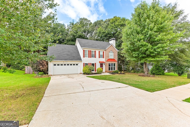 colonial inspired home with a front yard and a garage