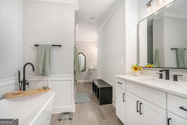 bathroom with vanity and crown molding