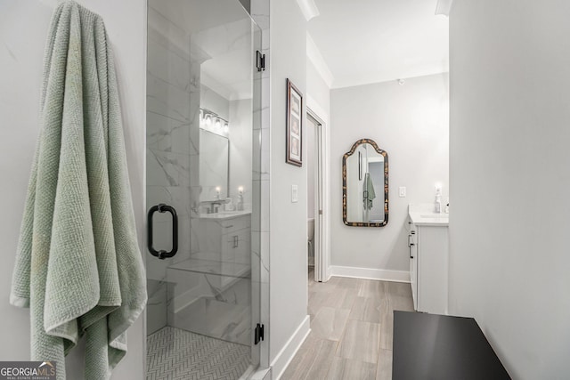 bathroom featuring vanity and a shower with shower door