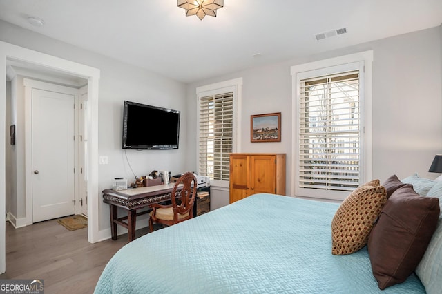 bedroom featuring wood-type flooring