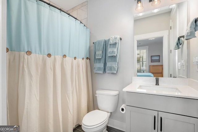 bathroom with vanity and toilet