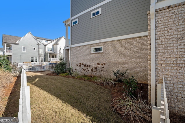 view of property exterior featuring a lawn