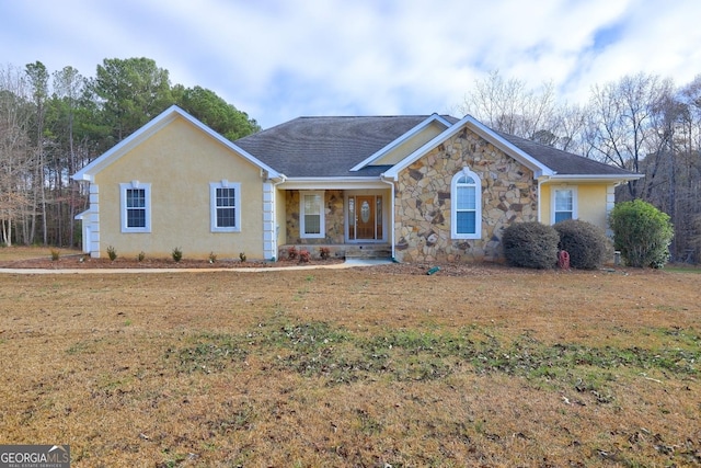 ranch-style house with a front lawn