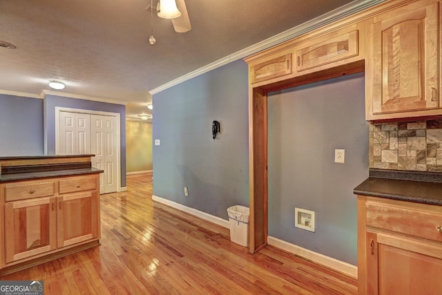 kitchen with light brown cabinets, tasteful backsplash, ceiling fan, and crown molding