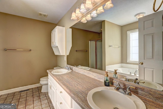 full bathroom with plus walk in shower, vanity, tile patterned floors, and toilet