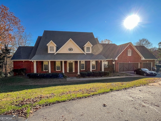 view of front of property with a garage and a front yard