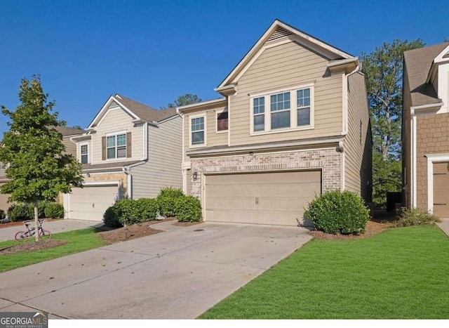 view of front of home with a front yard and a garage