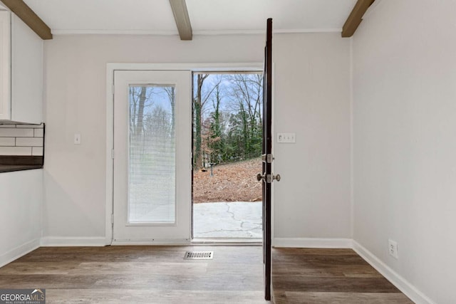 entryway with plenty of natural light, beamed ceiling, and hardwood / wood-style flooring