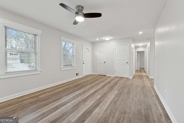 spare room with ceiling fan and light hardwood / wood-style floors