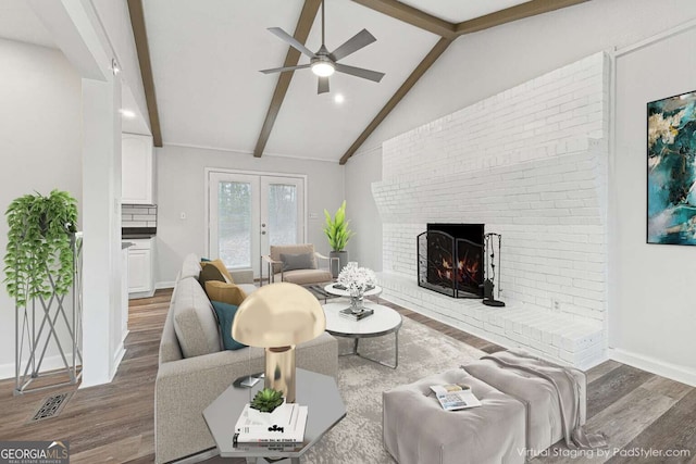 living room with ceiling fan, french doors, a brick fireplace, lofted ceiling with beams, and dark hardwood / wood-style floors