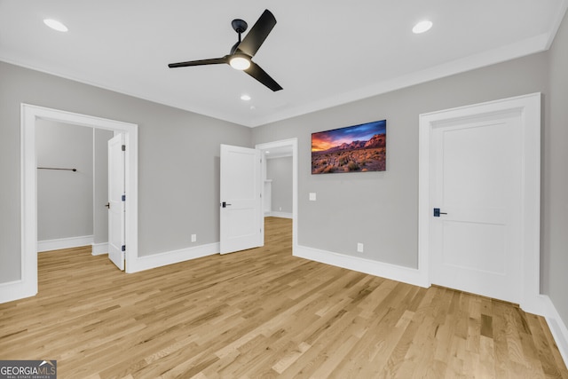 unfurnished bedroom featuring ceiling fan and light hardwood / wood-style flooring