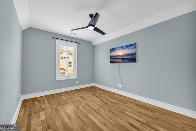 unfurnished room with ceiling fan, lofted ceiling, and light hardwood / wood-style flooring