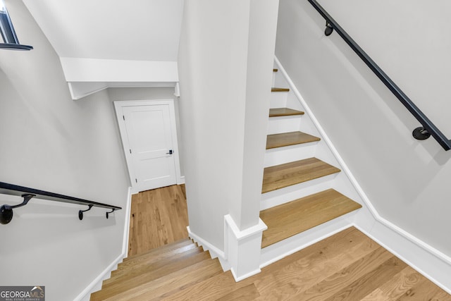 stairway featuring hardwood / wood-style flooring