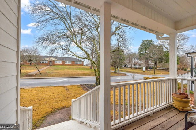 wooden terrace with a porch