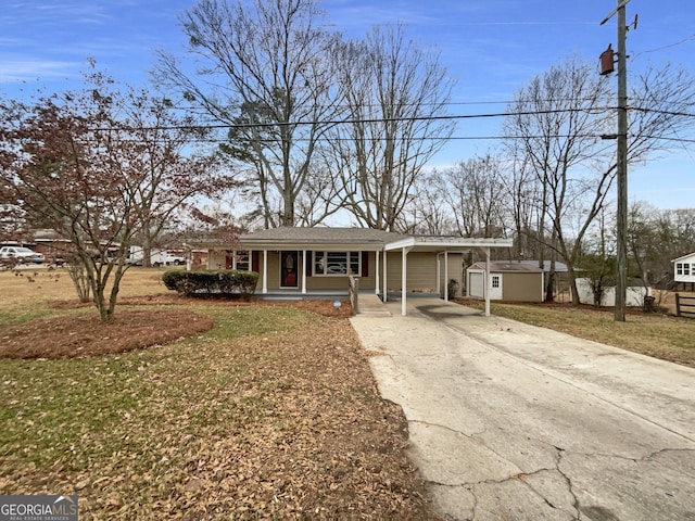 view of front facade with a carport, covered porch, and a front lawn