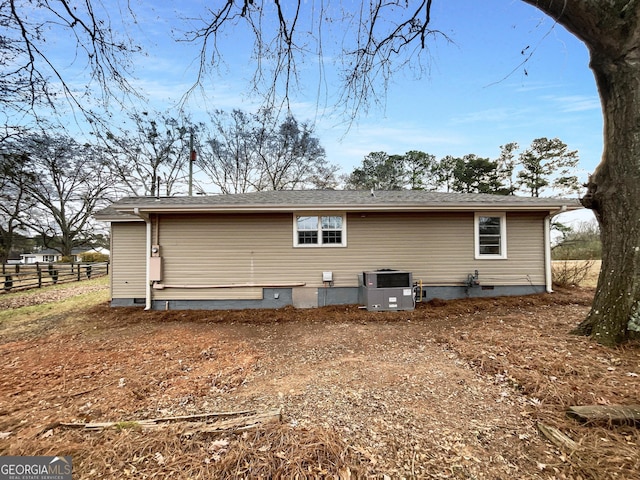 back of property featuring central air condition unit