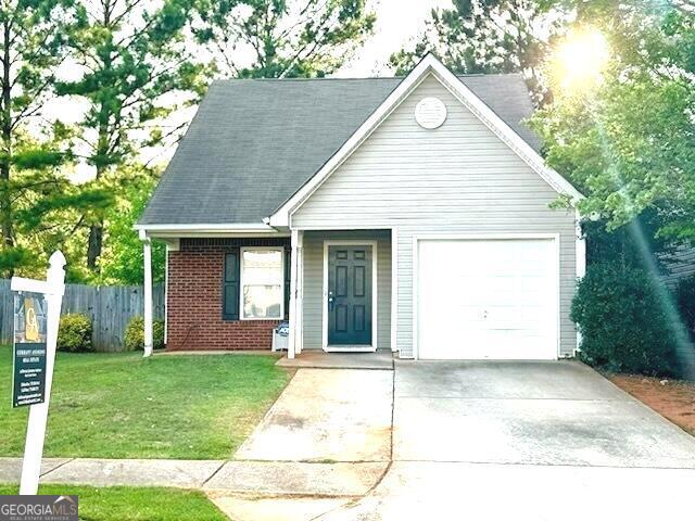 view of front facade with a front lawn and a garage