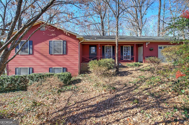 view of front of house featuring covered porch and a garage