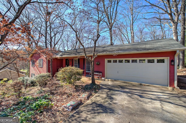 single story home featuring a garage