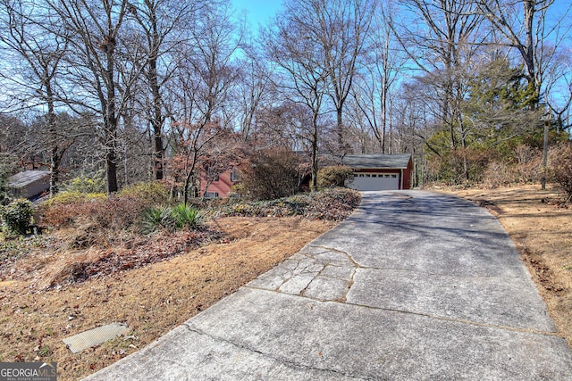 view of front of home with an outdoor structure and a garage