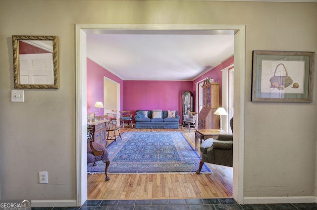 tiled living room featuring ornamental molding