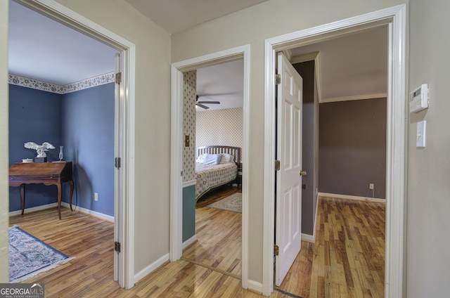 hall with wood-type flooring