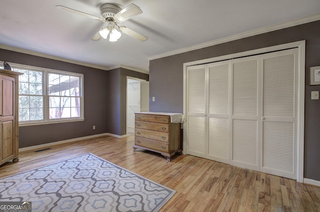 unfurnished bedroom featuring a closet, ceiling fan, and light hardwood / wood-style flooring