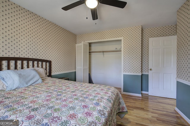 bedroom with a closet, ceiling fan, and light hardwood / wood-style floors