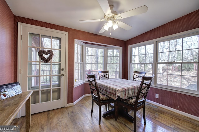 dining area featuring ceiling fan and wood-type flooring