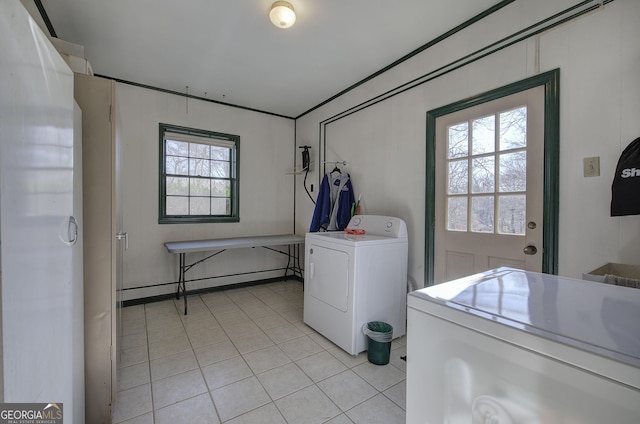 washroom featuring light tile patterned floors and washer / dryer