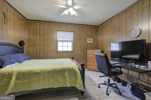 tiled bedroom featuring ceiling fan, ornamental molding, and wooden walls