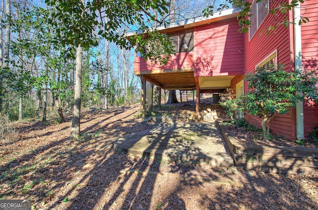 view of yard with a wooden deck