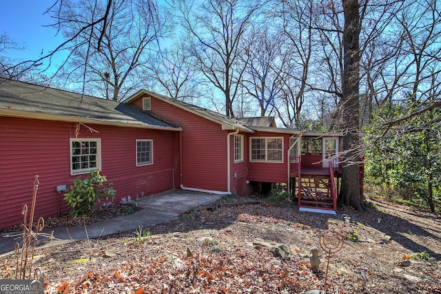 rear view of property with a deck