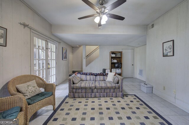 living room with visible vents, ceiling fan, stairway, and light tile patterned floors