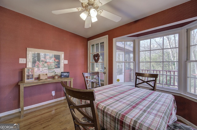 dining room featuring hardwood / wood-style floors and ceiling fan