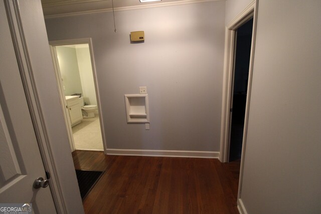 hall featuring dark hardwood / wood-style floors and ornamental molding