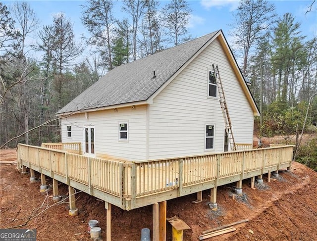 rear view of property with a deck