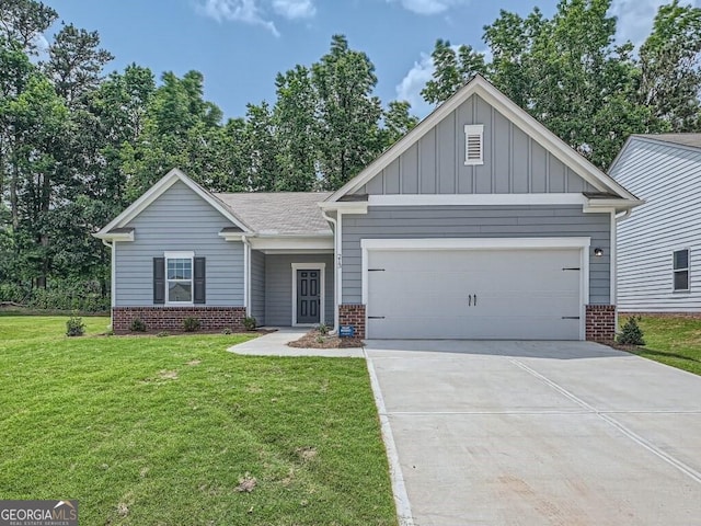 view of front of property featuring an attached garage, a front yard, board and batten siding, and brick siding