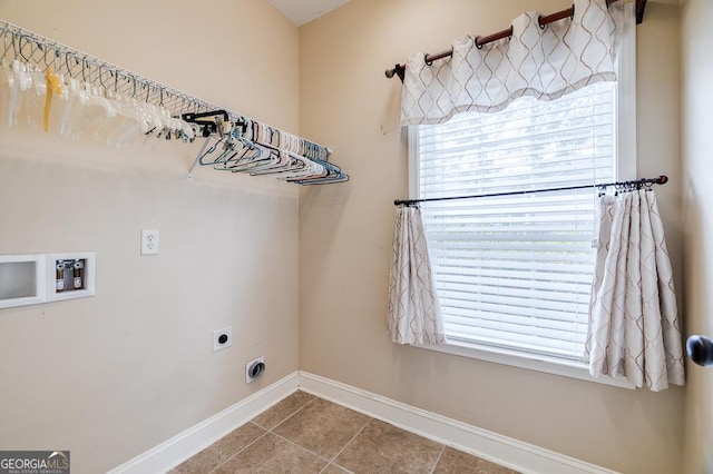 laundry area featuring electric dryer hookup, hookup for a washing machine, and tile patterned flooring