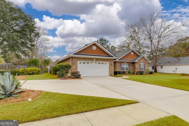 view of front of home with a garage and a front lawn