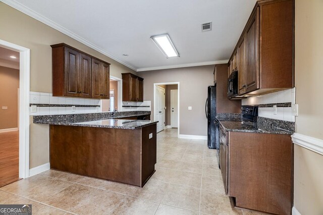 kitchen featuring decorative backsplash, dark stone counters, crown molding, black appliances, and light tile patterned floors