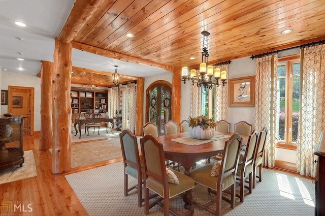 dining space with wooden ceiling, beam ceiling, light wood-type flooring, and an inviting chandelier