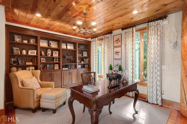 home office with light hardwood / wood-style flooring, wooden ceiling, and a notable chandelier