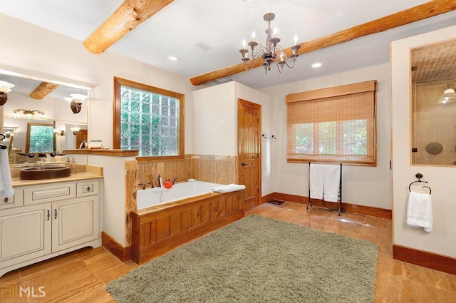 bathroom featuring tile patterned floors, vanity, a bath, beamed ceiling, and a chandelier