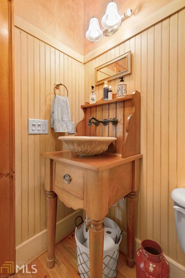 misc room featuring light wood-type flooring and sink