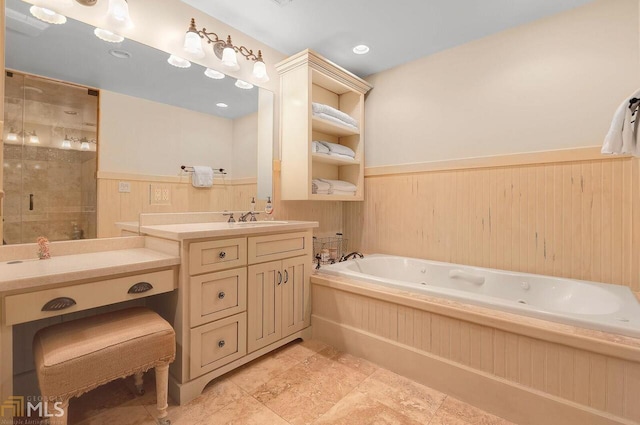 bathroom with wooden walls, vanity, and independent shower and bath