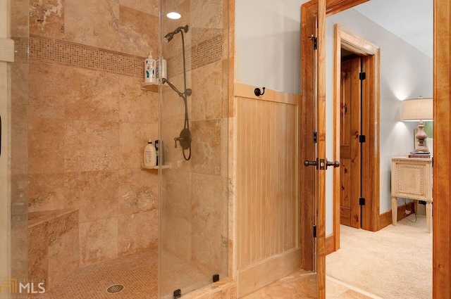 bathroom with tiled shower