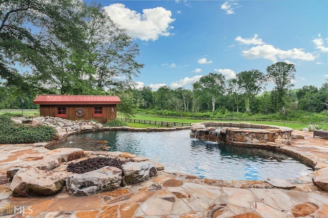 view of pool with a storage shed