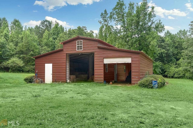 view of outdoor structure with a lawn